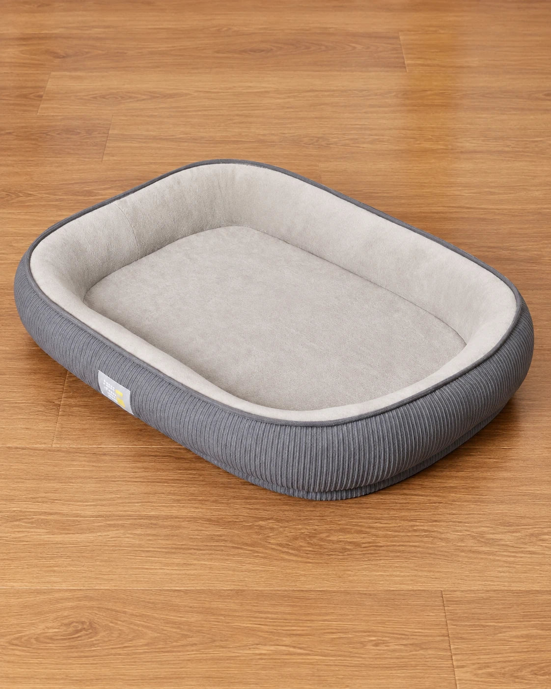 Grey After-Walk Comfort Dog Bed with soft plush interior and ribbed grey sides